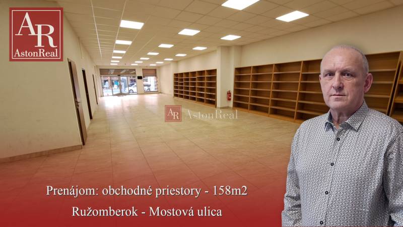 Commercial premises for rent on Mostová Street in Ružomberok, with shelves and flooring with a wooden decor.