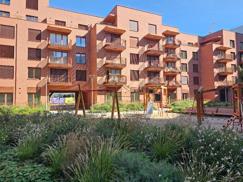 Residential complex in Bratislava - Ružinov on Košice Street with a playground and greenery.