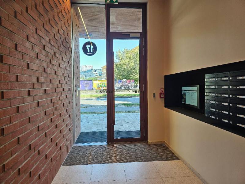 Entrance hall with mailboxes and a brick wall on Košicá Street, in Bratislava - Ružinov.
