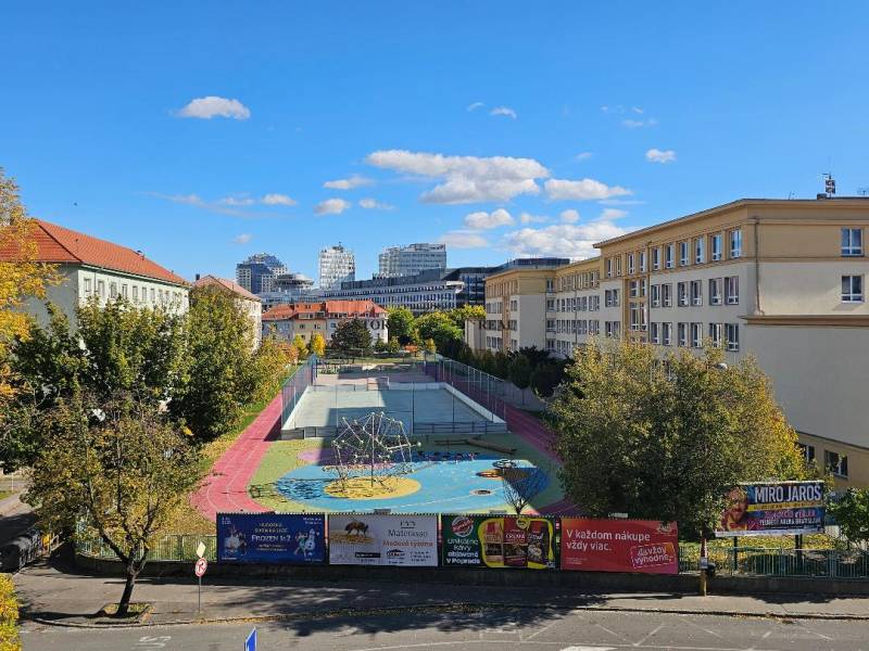 Playground and sports field in Bratislava - Ružinov, on Košická Street surrounded by buildings.