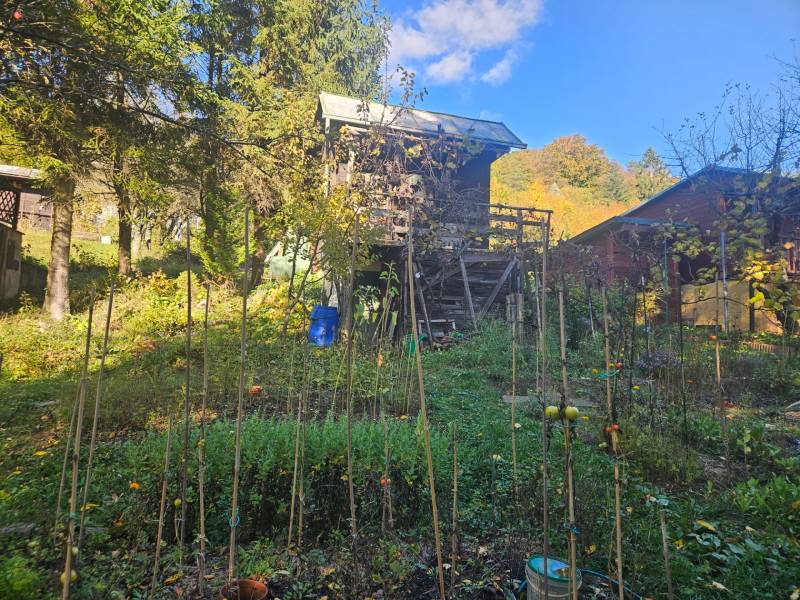 A cottage in Trenčianske Teplice on Sady pod Dedovcom street surrounded by a green garden.