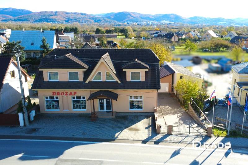 A family house in Bolešov with a garden and a view of the surrounding mountains.