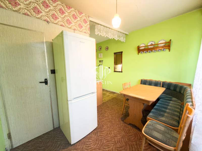 Dining area with a sofa set and table in a 3-room apartment.