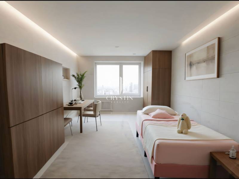 Bedroom in a 3-room apartment with a bed, a desk, and a wooden-decor floor.