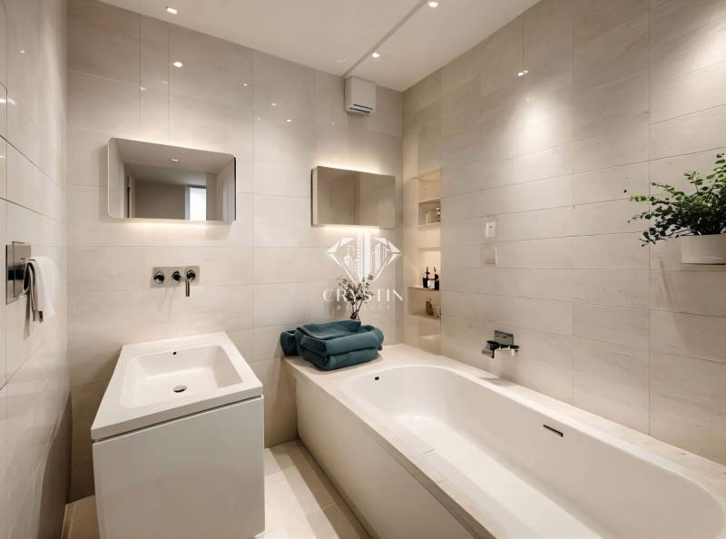 A bathroom with a white bathtub, sink, and mirror in a 3-room apartment.