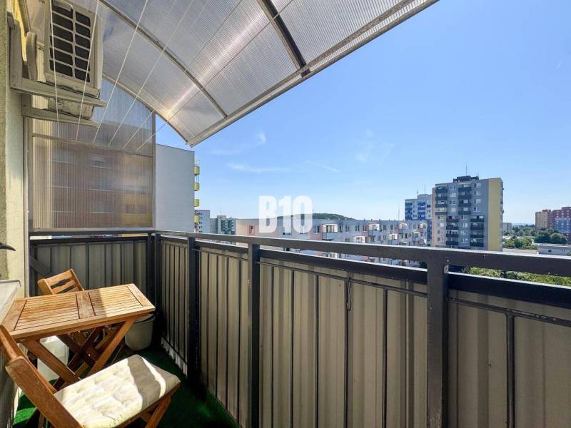 Balcony of a 4-room apartment in Nitra with a view of the surrounding panel buildings.