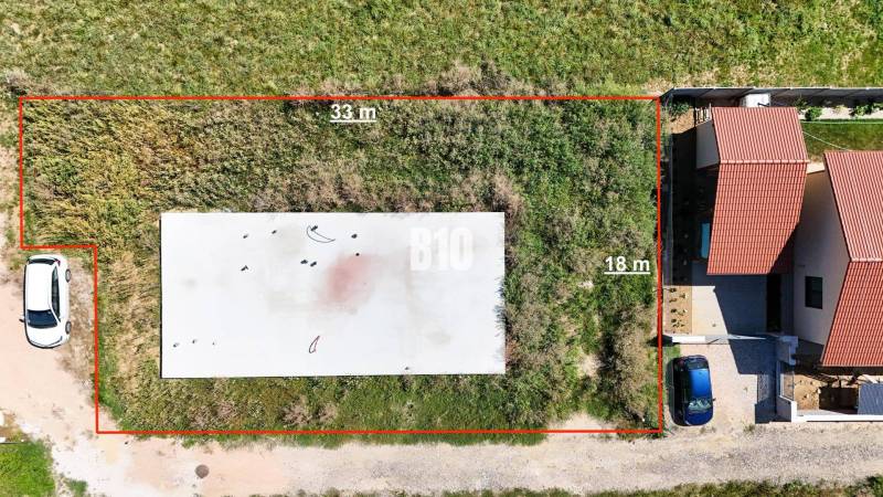 Plots in Čeľadice suitable for living, with a view of the neighboring building.