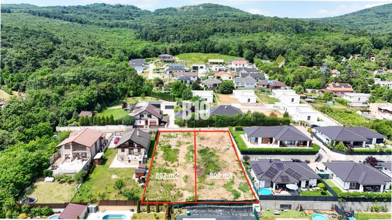 Land - housing in Štitáre, surrounded by houses and forests, ready for construction.