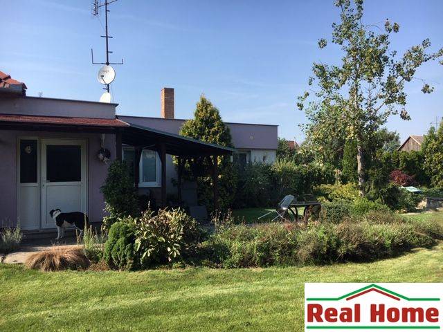 A family house in Čierna Voda with a garden, a dog, and an adjacent terrace for relaxation.
