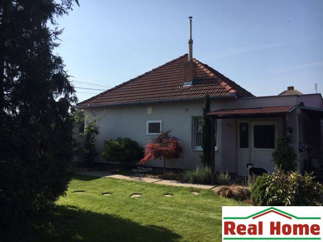 A family house in Čierna Voda with a landscaped garden and a terrace for relaxation.
