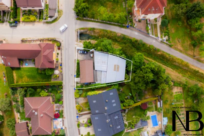 Aerial view of a family house in Trenčín on Záblatská Street, surrounded by greenery.