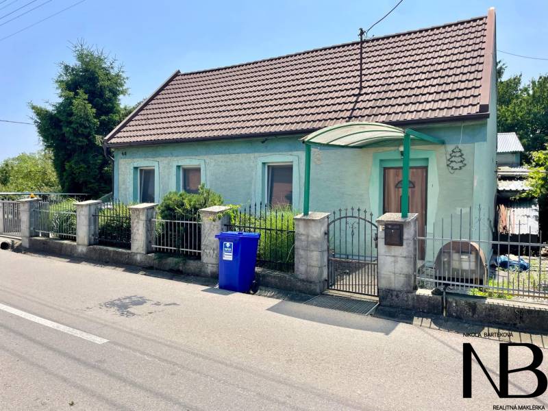 A family house on Záblatská Street in Trenčín with a blue facade and gate.