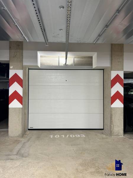Garage parking with a gate in the building on Karpatská Street in Poprad.