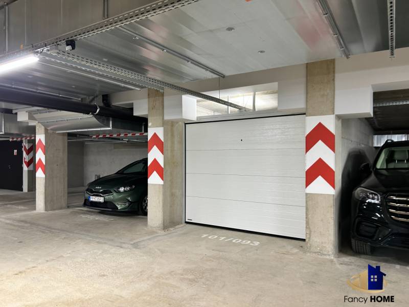 Garage parking on Karpatská Street in Poprad with space for two cars.