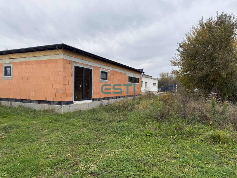 A family house on Na Kúty Street in Teplička nad Váhom with an unplastered facade.