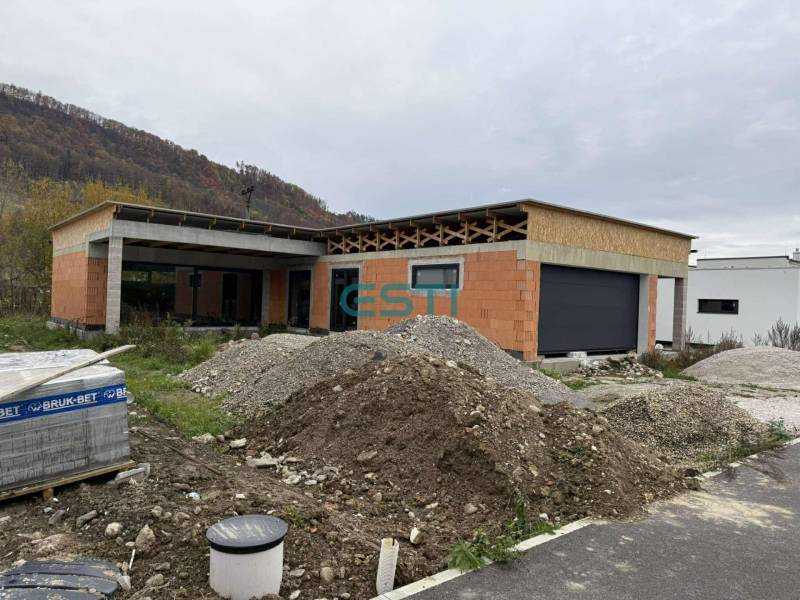 Family house under construction, Teplička nad Váhom, Na Kúty, with piles of soil and construction materials.