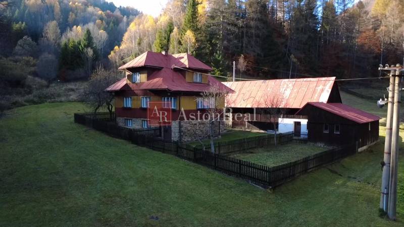 A family house in Zázrivá surrounded by nature and forests, with a large yard space.