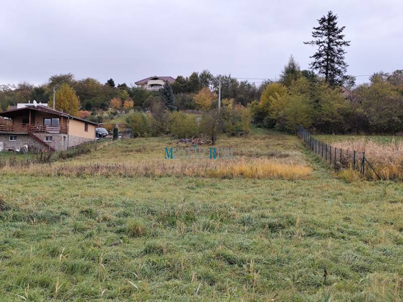 Exterior in the area of Velký Bab, suitable for residential plots, with houses and nature.