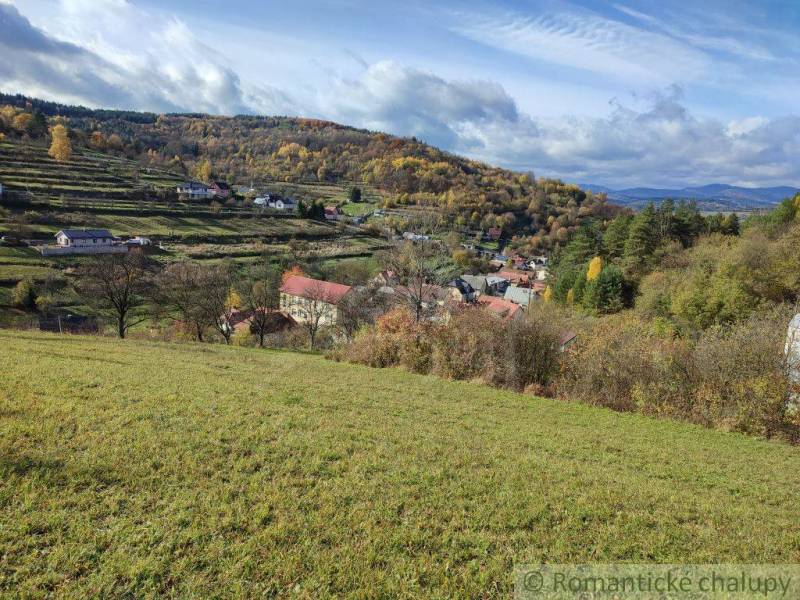 Autumn in the gardens of Hlboké nad Váhom, with scattered houses and colorful trees.