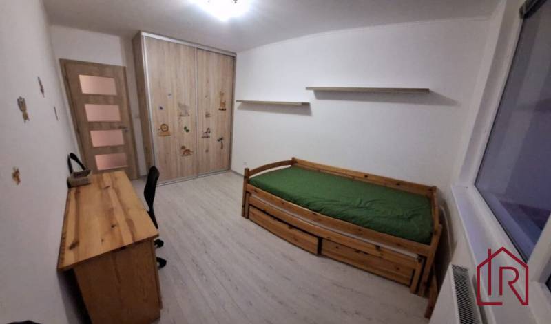 Children's room with a bed, desk, and wardrobe in a 3-room apartment.