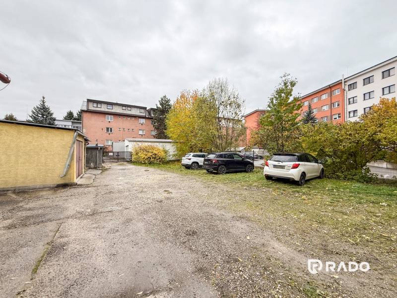 Parking lot with cars on Bratislavská Street in Žilina near the offices.
