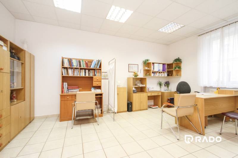 Offices with furniture, chairs, and bookshelves, floor with ceramic tiles.