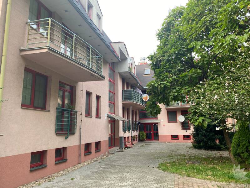 Apartment building with balconies and greenery on Mierová Street in Bratislava, Ružinov district.