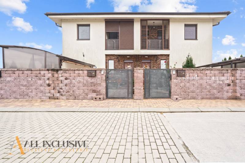 Two-story house with a brick fence in Gabčíkovo, suitable for a 3-room apartment.