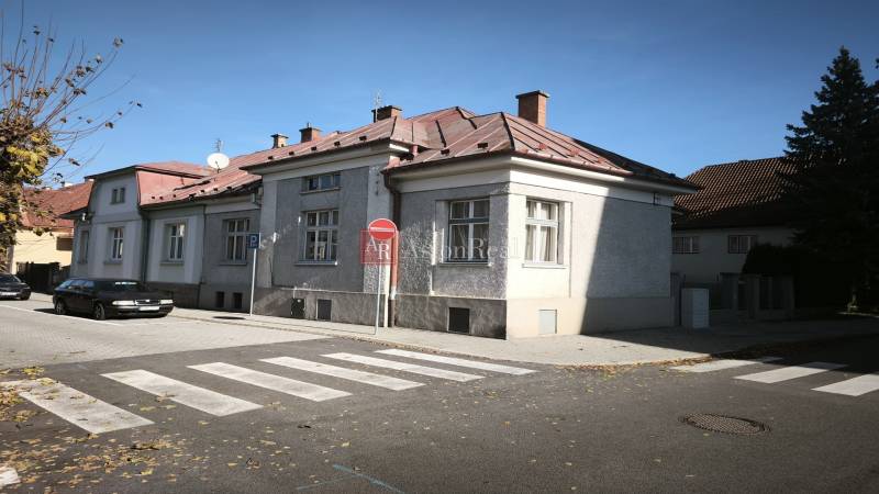 A family house in Uhlisko, Banská Bystrica with a car on the street.