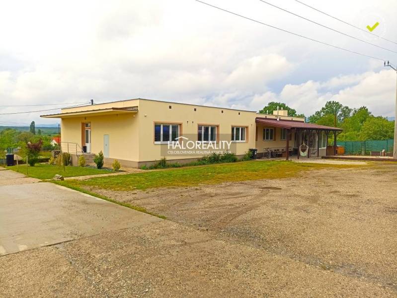 Outdoor terrace at a 3-room apartment in Štefanová with chairs and bicycles.