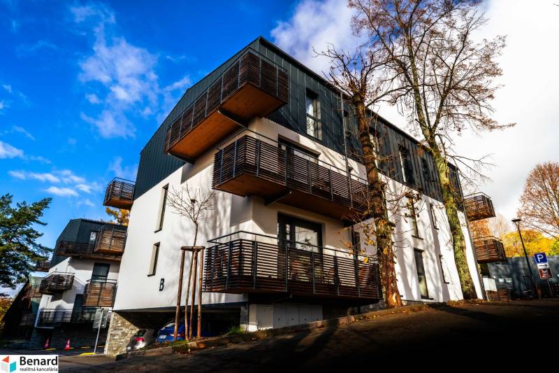 Apartment complex on Lúčná Street in Štrba with balconies and parking in a beautiful environment.