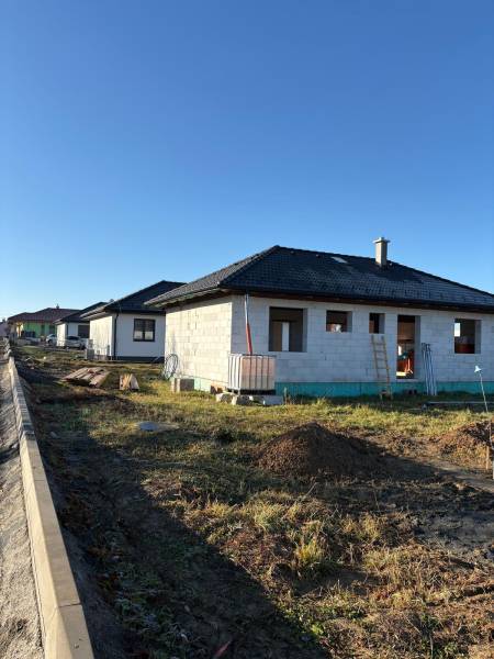 An unfinished family house on Vyšná Šebastová Street in Prešov under sunny weather.