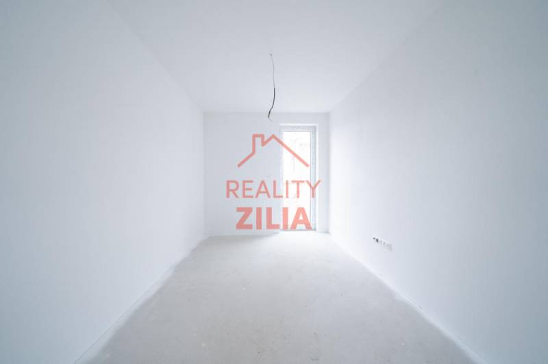 An empty interior with white walls and open doors in a family house.