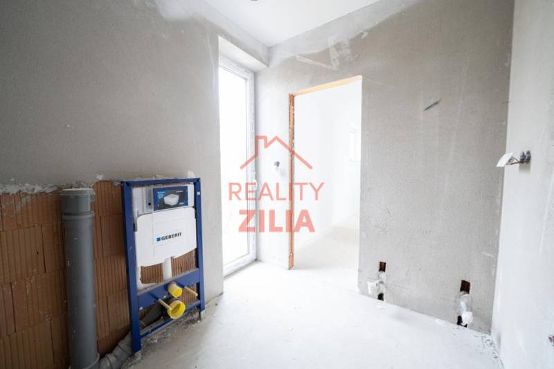 Interior of a family house with an installation system and plastered walls ready for completion.