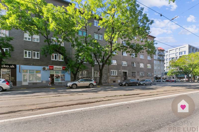 Vajnorská Street in Bratislava - Nové Mesto, where there are residential buildings and shops.