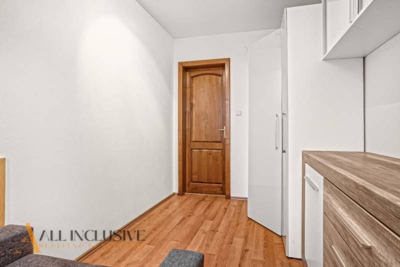 Interior of a family house with a wooden decor floor and wooden doors.