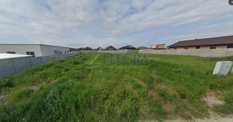 Plots - residential in Čaňa, fenced, with grassy area suitable for building houses.