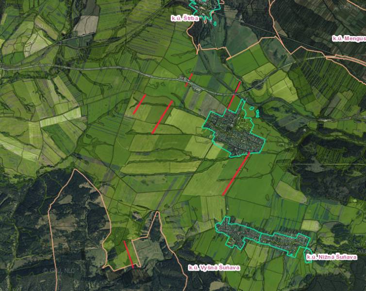 Aerial view of agricultural and forest lands around Štrba with marked boundaries of cadastral areas.