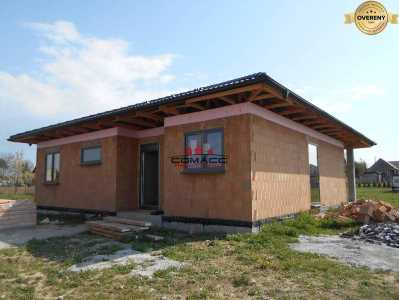 A family house in Nové Mesto nad Váhom under construction, surrounded by a grassy plot.