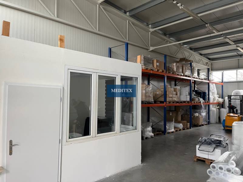 Warehouses and halls with shelves, goods, and a forklift.