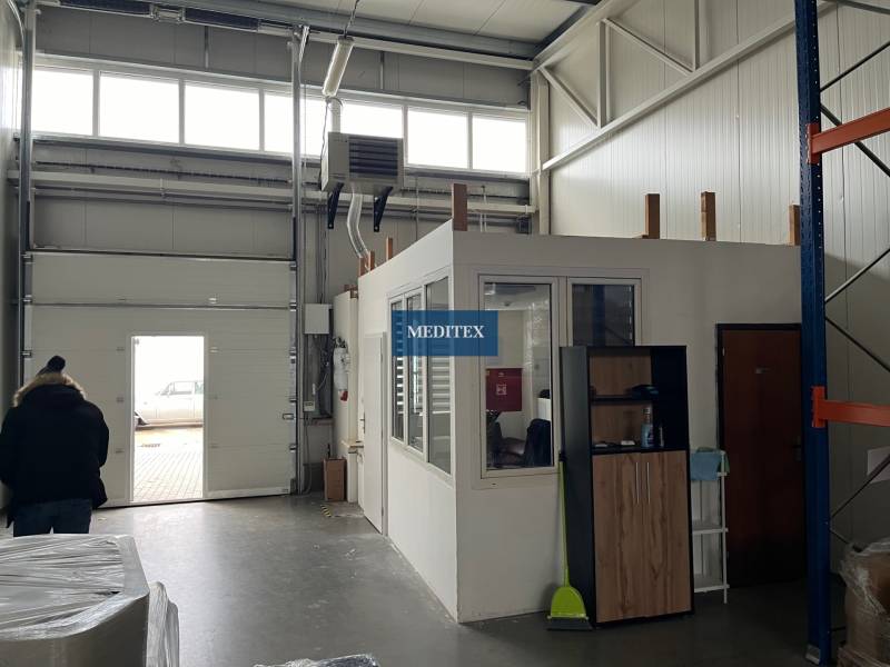 Interior of warehouses and halls with a transition gate and a small office on top.