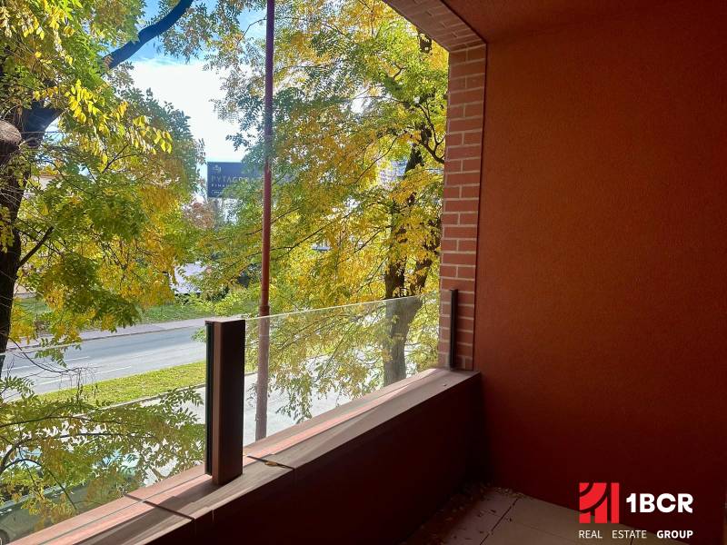 The balcony of a 1-room apartment on Košická Street in Bratislava - Ružinov with a view of greenery.