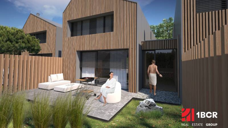 Family house in Turecká with wooden cladding, terrace, garden furniture, exterior.