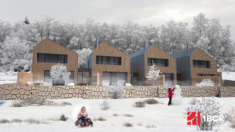 A family house in Turecká, snowy environment, children playing in the snow in front of the house.