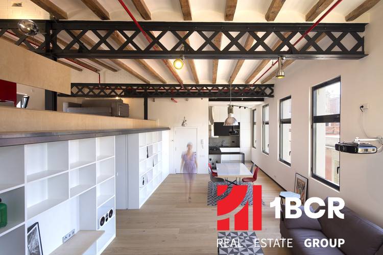 Spacious interior with wood-patterned flooring and open shelving in warehouses and halls.