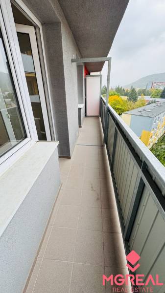 Balcony at a 1-room apartment on Malá Okružná in Partizánske, view of trees.
