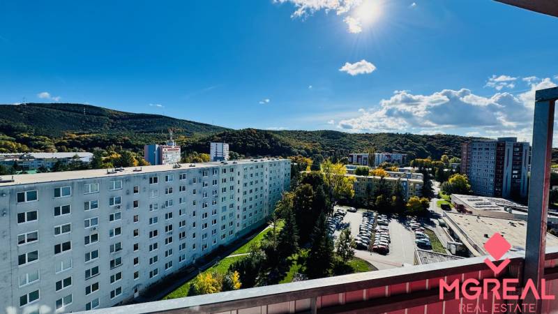 View from the balcony of apartment buildings and nature in Partizánske on Nádražná Street.