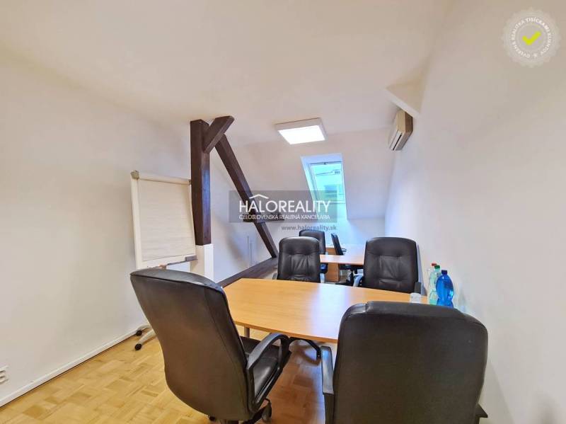 Offices with a desk, leather chairs, and a board. Floor with wooden decor.