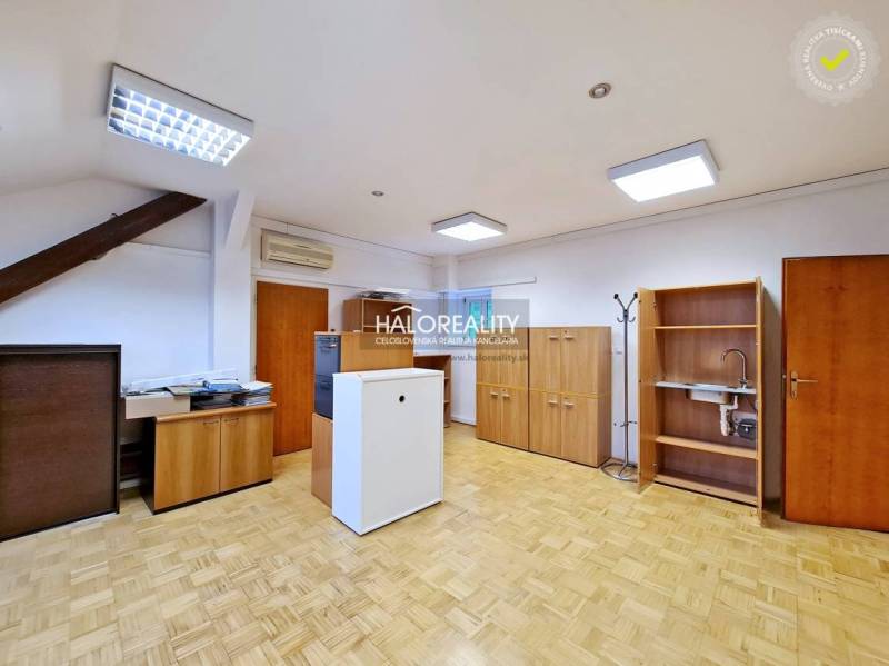 Offices with wood-patterned flooring, wooden furniture, and air conditioning.