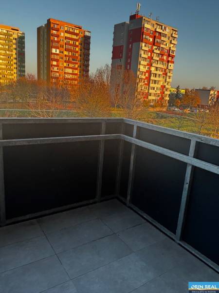 The balcony of a 2-room apartment on Okružná Street in Pezinok with a view of the surrounding apartment buildings.